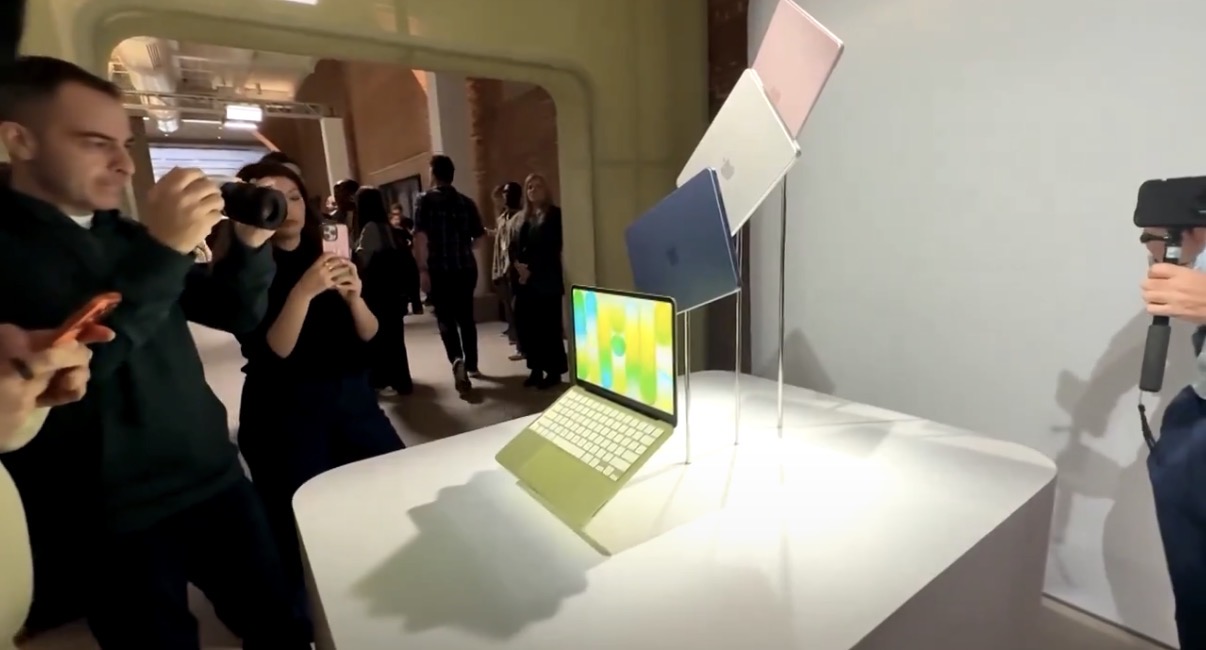 People photographing the MacBook Neo at Apple's launch event